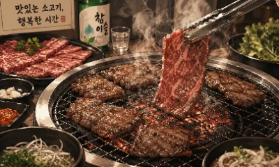 Korean BBQ beef on grill with smoke